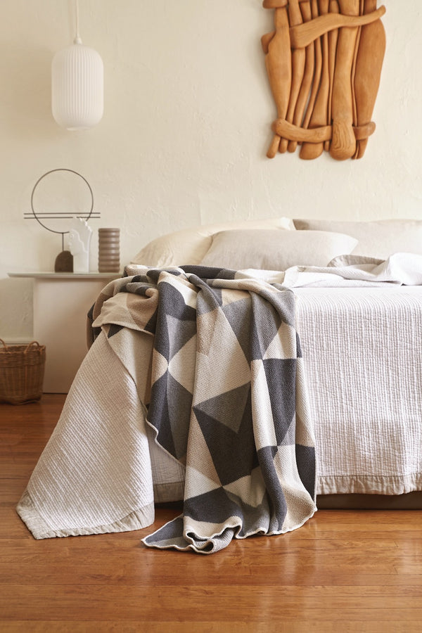 Grey and Beige Geometric Cotton Throw in Neutral Bedroom