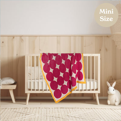 Modern Neutral Nursery with Bright Pink Baby Blanket