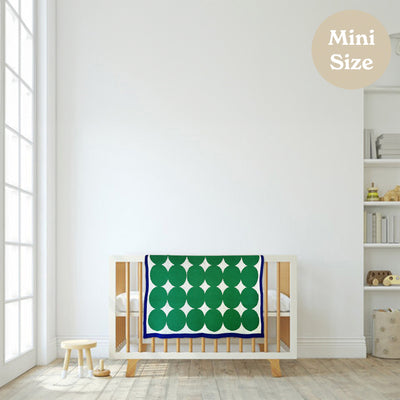 White Nursery with Modern Green and Blue Baby Blanket