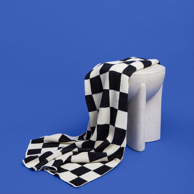 Black and White Checkered Throw on Blue Background