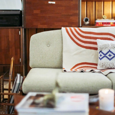 Bohemian Living Room with Wavy Line Blanket in Beige and Orange