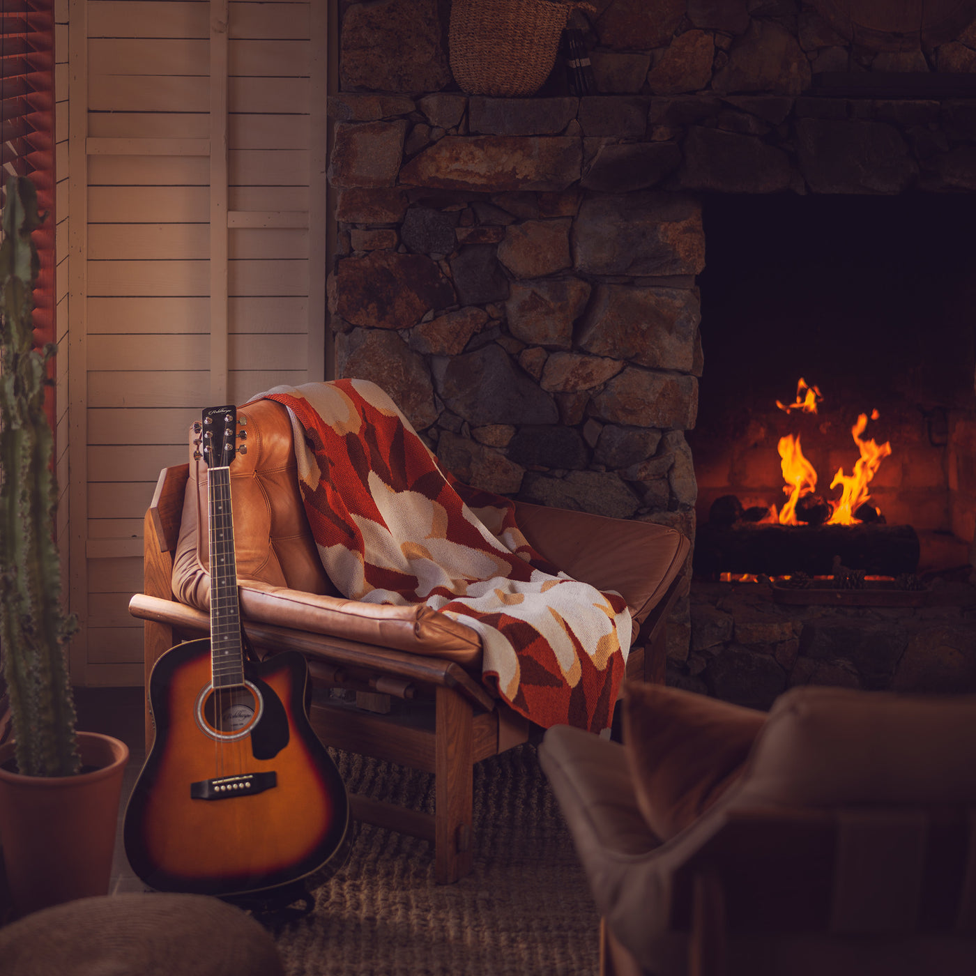 Rust Flower Cotton Throw by the Fire with Guitar