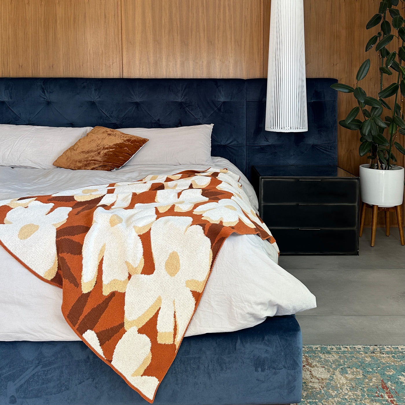 Mid Century Modern Bedroom with Rust Flower Throw Blanket