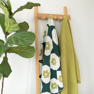 Pair of Green Throws on a Coatrack