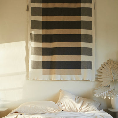 Modern Throw Hanging on Wall in Bedroom