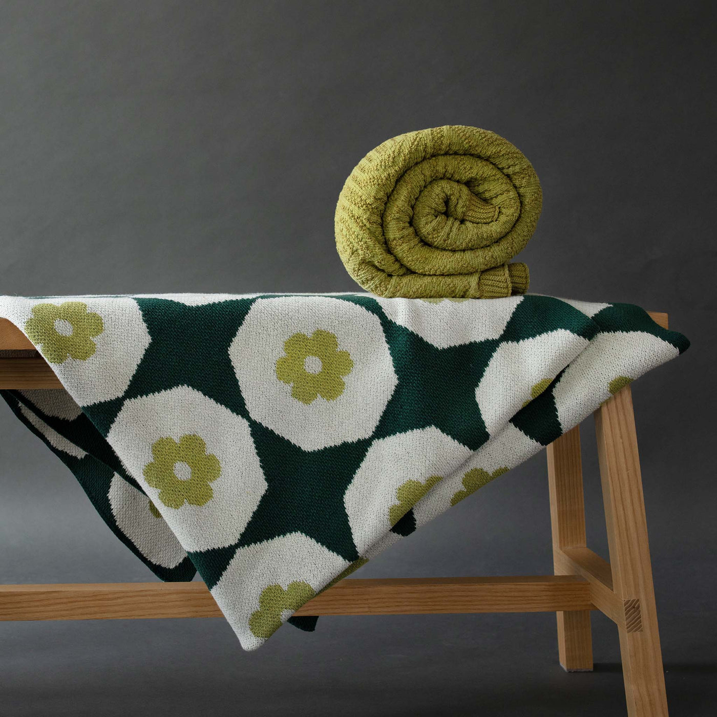 Green Cotton Throws on a bench