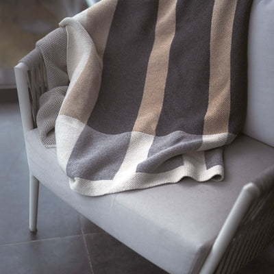 High End Beige and Grey Throw on Grey Chair 