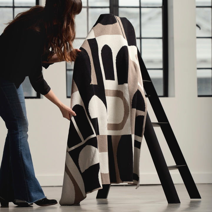 Modern Black Stepladder and a Throw Blanket
