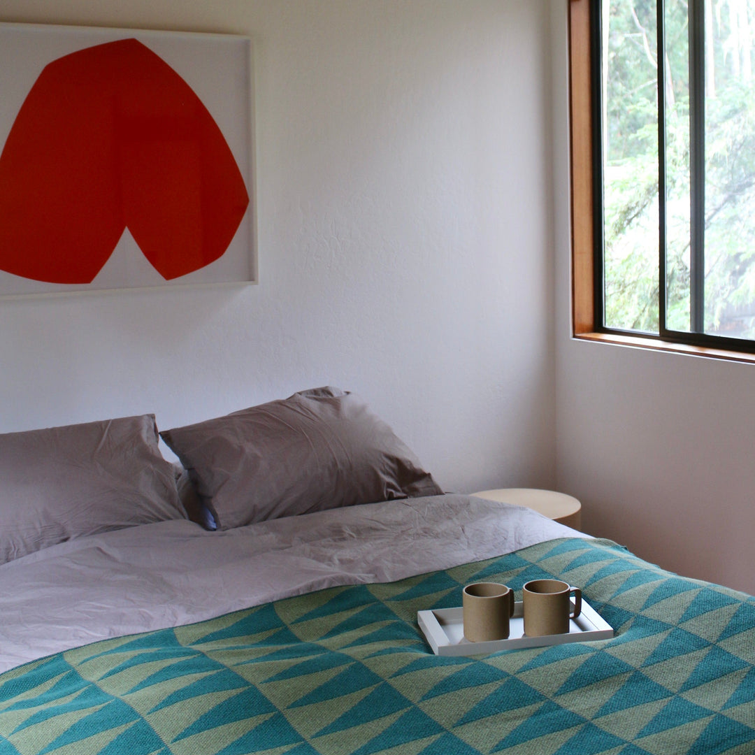 Geometric Green Throw in modern bedroom with 