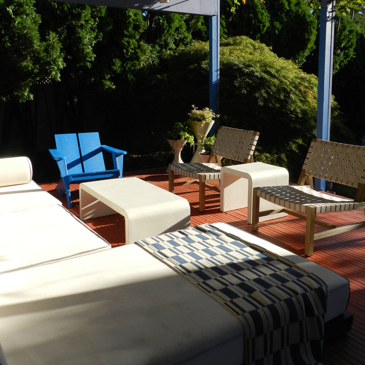 Blue and Tan Checked Throw in a modern sunny patio