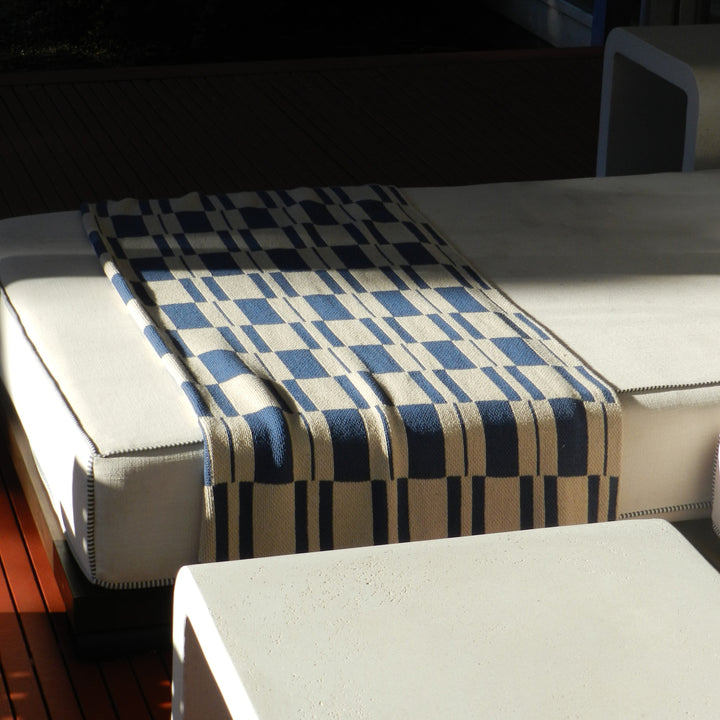 Blue Checked Modern Throw on an Ottoman