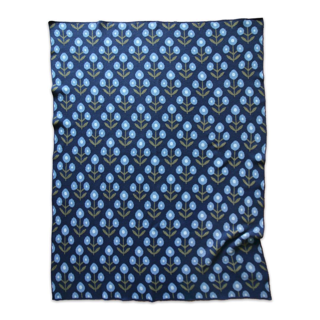 Navy blue blanket with a light blue floral pattern