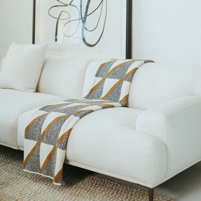 Black and Gold Luxury Throw on White Sofa