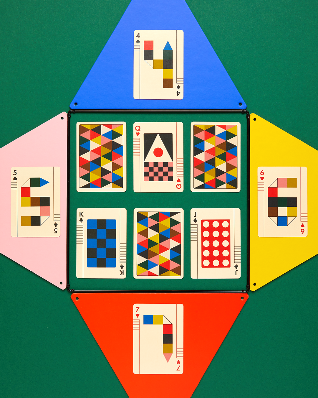 Geometrically shaped cards with colorful patterns on a green background