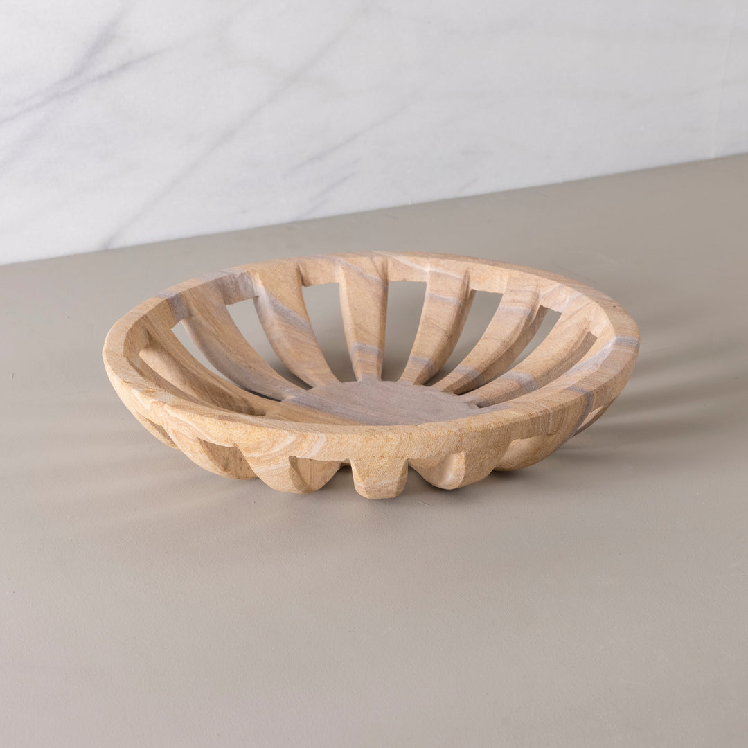 Wooden bread basket on a beige surface with a light gray background