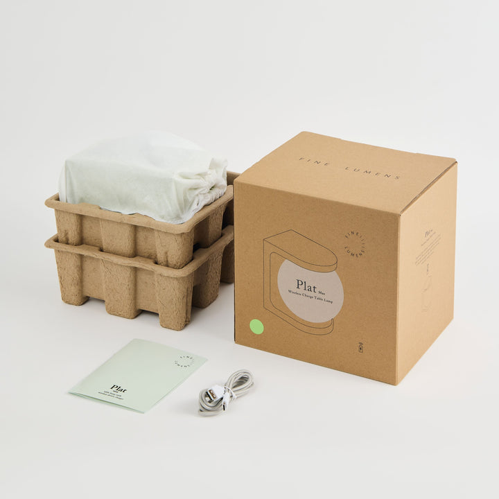 Plat packaging with cardboard basket, paper bag, and spoon on a white background