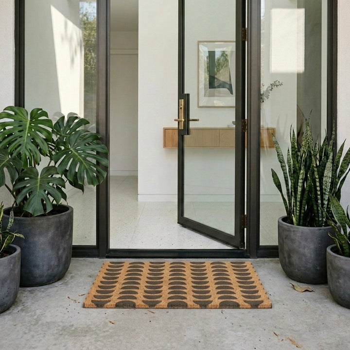 half moons doormat on modern front doorway