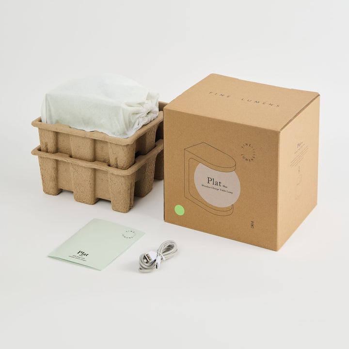 Plat packaging with cardboard basket, paper bag, and spoon on a white background