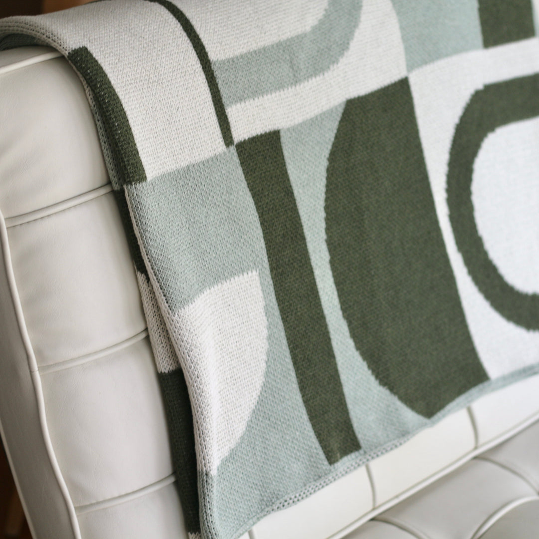 It's Takes a Villa Throw Blanket in Greens