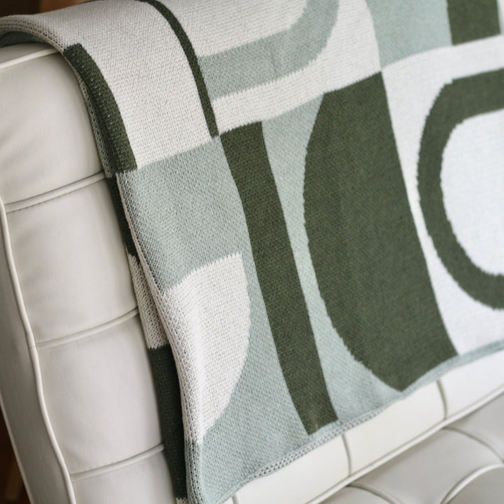 It's Takes a Villa Throw Blanket in Greens