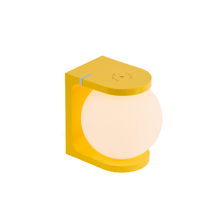 Yellow lamp with a round glass shade on a white background