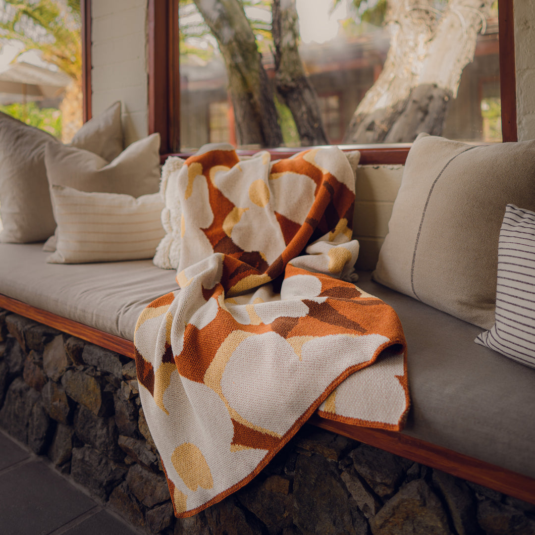 Orange Floral Throw on the patio