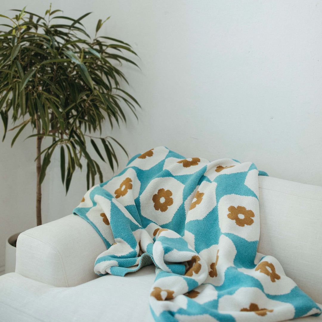 Ochre and Turquoise Flower Throw on White Sofa